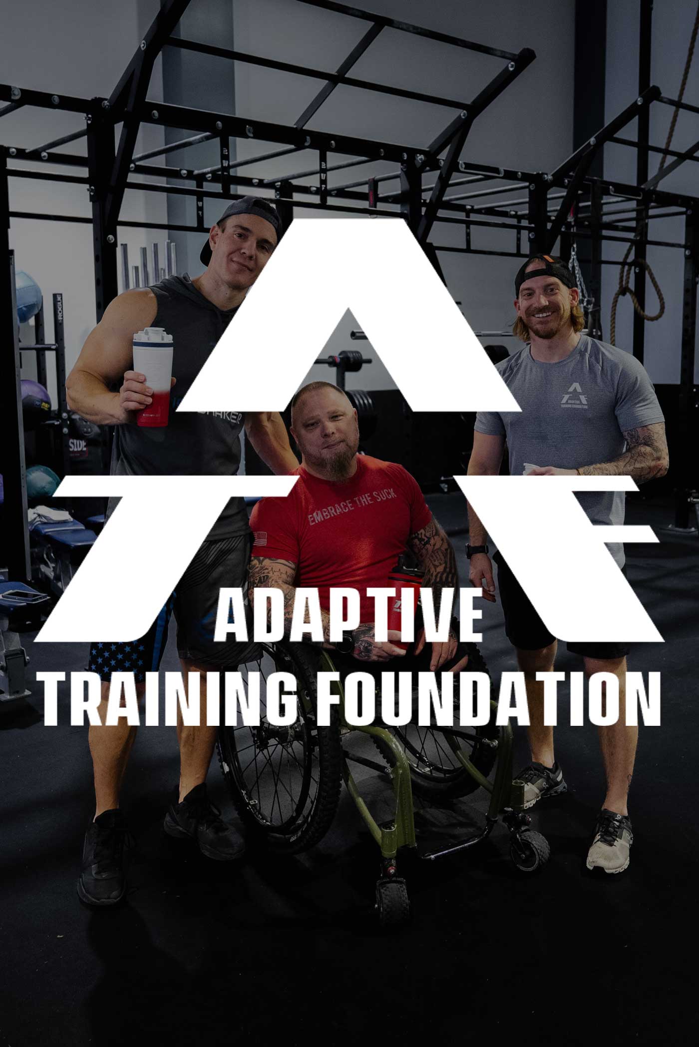 Ice Shaker CEO, Chris Gronkowski takes a picture with an Adaptive Training Foundation trainee and trainer. The Adaptive Training Foundation logo is overlayed on top of the image.