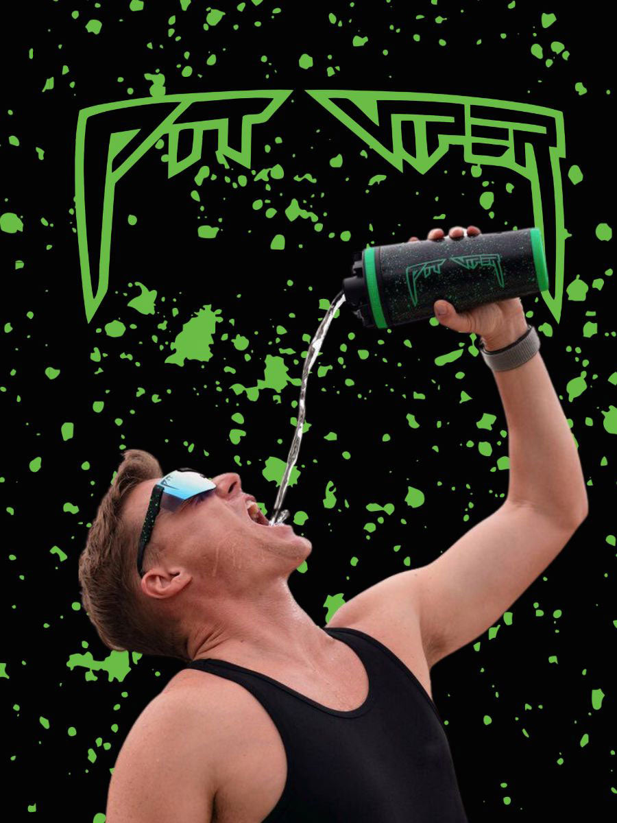 An banner that stretches across the width of the page. On it is the Pit Viper Logo outlined in a bright green color with splashes of light green all over the banner. In the center of the banner is a man in a black tank, wearing the Pit Viper X Ice Shaker Sunglasses and extending his hand above his head as he pours water into his mouth from the Custom Pit Viper 26oz Ice Shaker