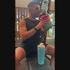 This 8-second video shows a man in a gym, opening the inner jug lid and pouring water into a Caribbean Blue-colored Ice Shaker