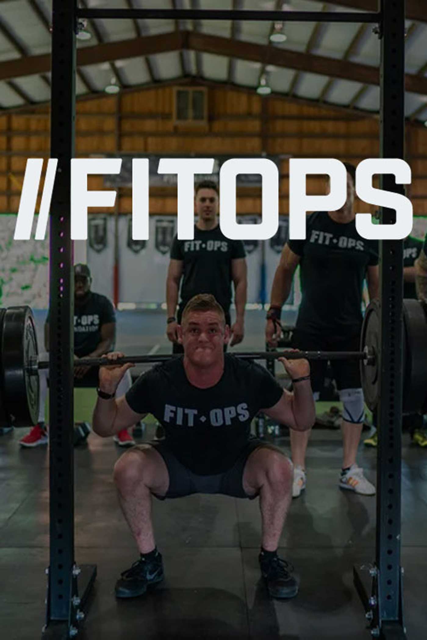 A member of the fitops team does a squat with weights on his shoulders. The FITOPS logo overlays on top of the image.