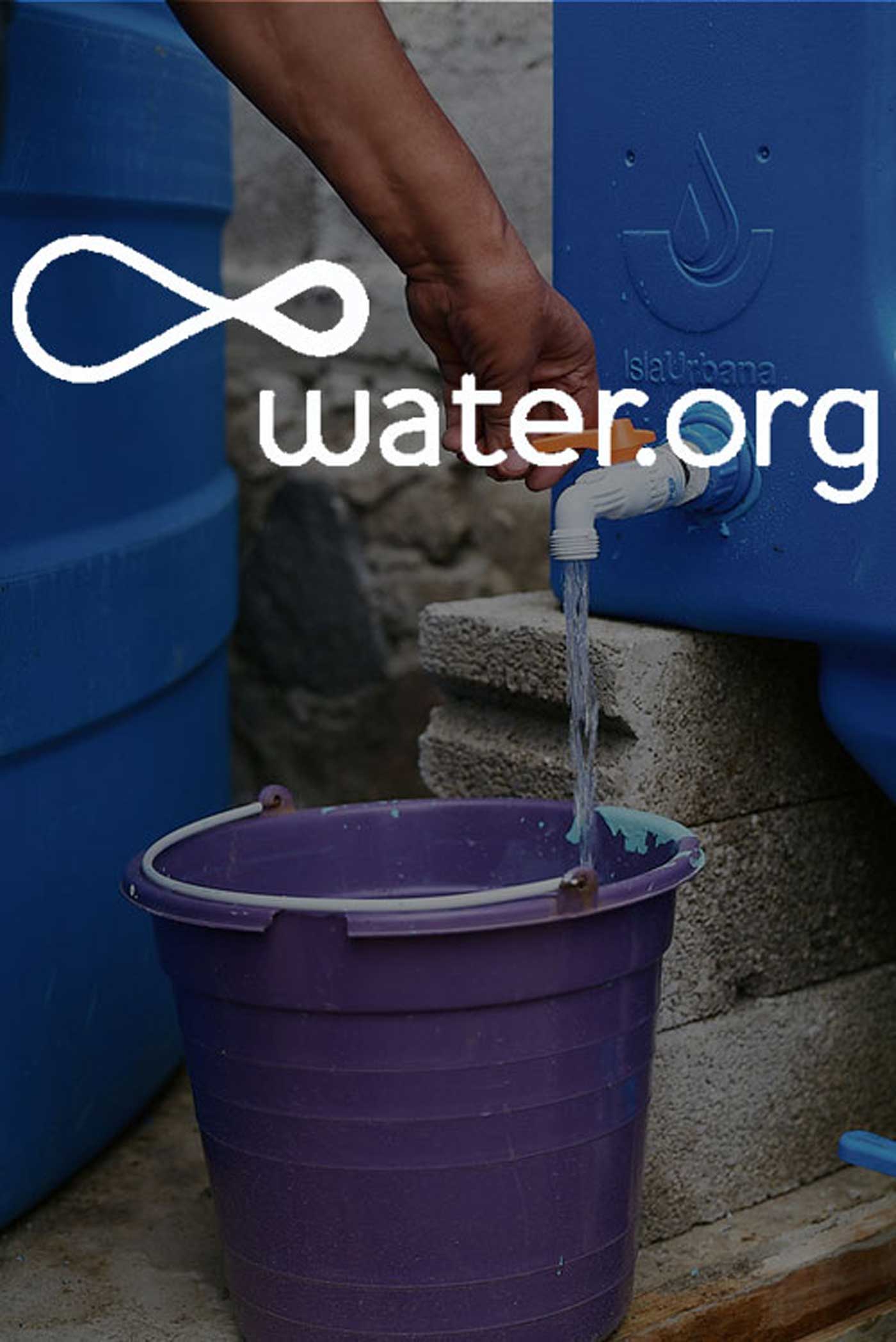Water pours into a bucket. The Water.org logo overlays on top of the image.