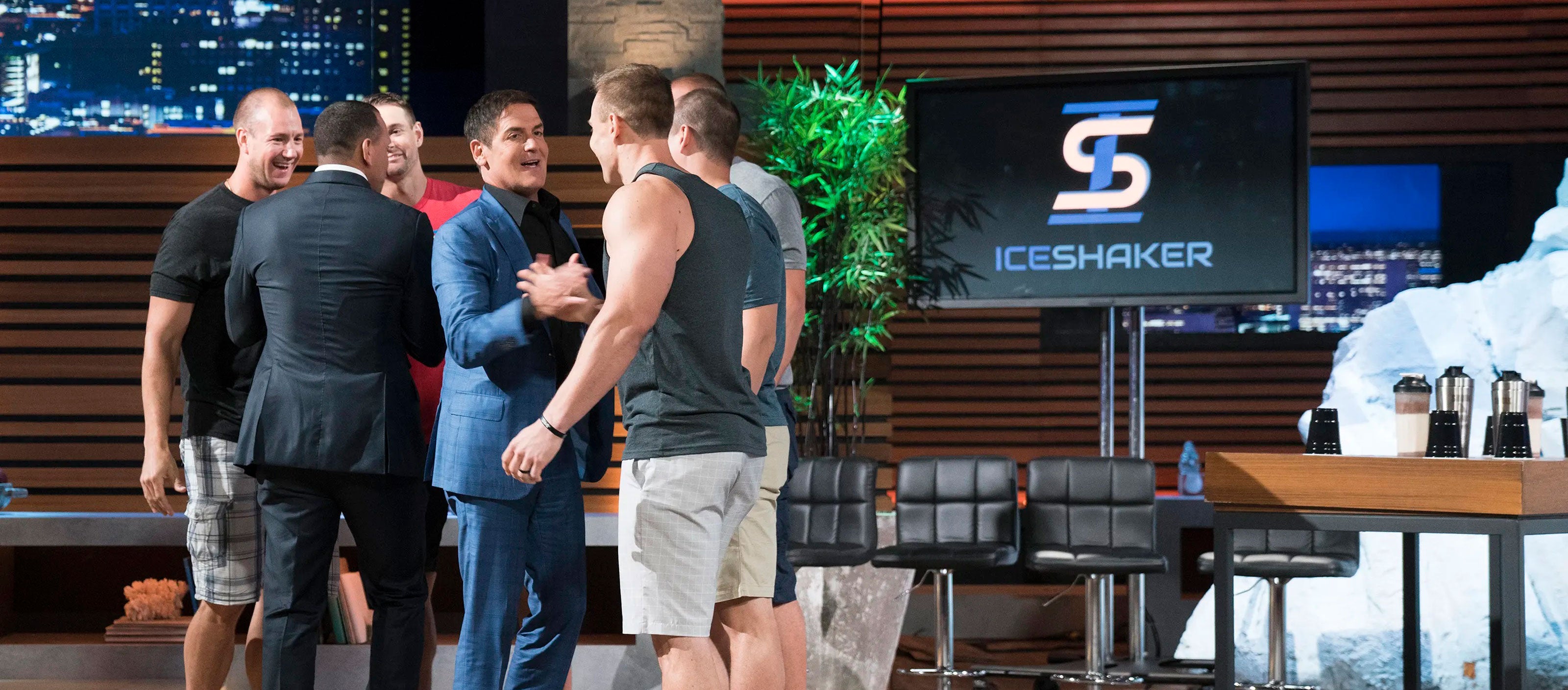 A banner containing an image of Ice Shaker CEO, Chris Gronkowski & brothers shaking hands with Mark Cuban and Alex Rodriguez on the set of ABC's Shark Tank.