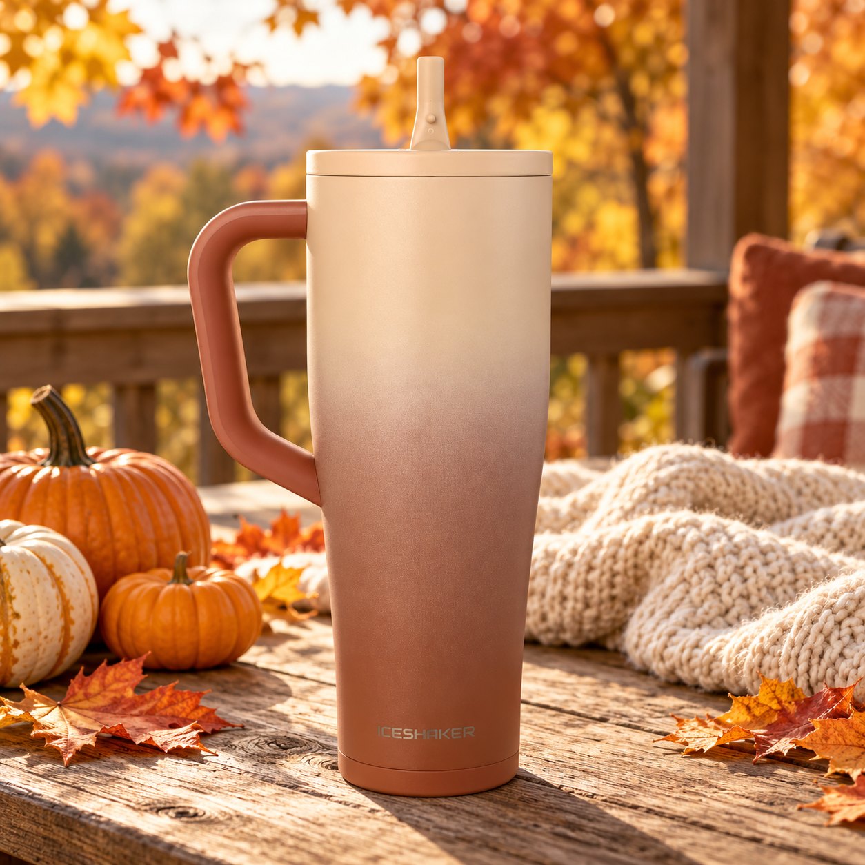 Mocha Ombre Legend Tumbler on a wooden porch table with pumpkins, fall leaves and a knit blanket