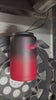 This is a .gif image that is showing a Red Black Ombre One Gallon Ice Shaker jug being engraved by our state-of-the-art laser engraving machine. Click now to visit the Ice Shaker Custom Shop where you can select a bottle to get engraved.