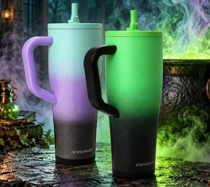 Glitter 13 Moons and Witches Brew tumblers side by side beside a bubbling green cauldron